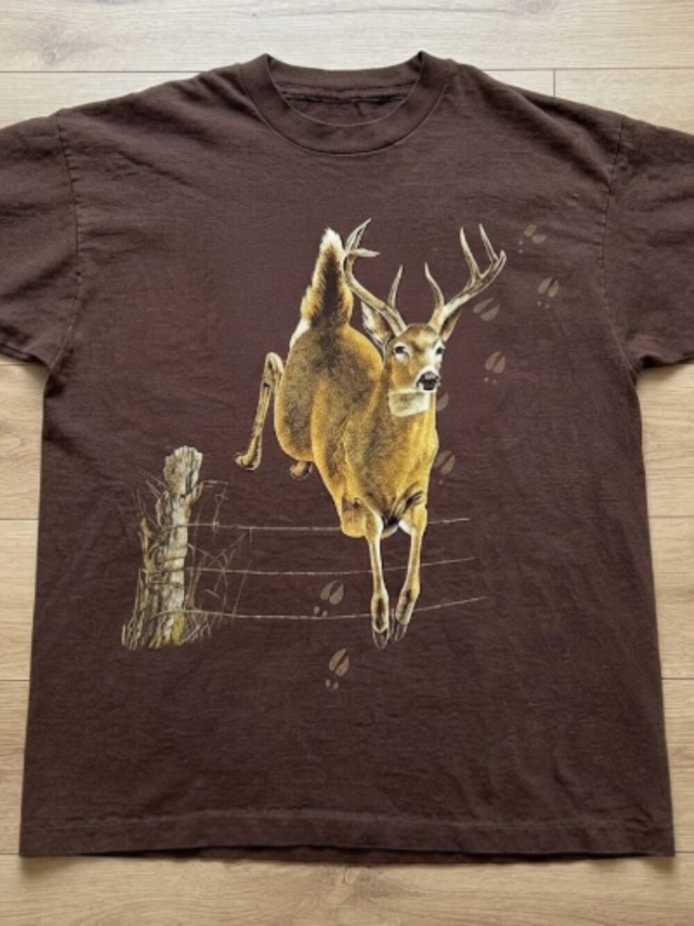 Deer graphic tee with deer jumping over a fence brown t shirt